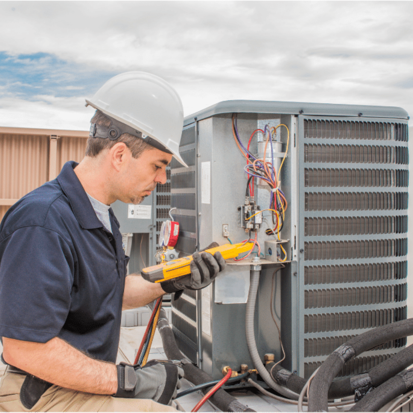 Woodstock HVAC Pros HVAC technician servicing a system