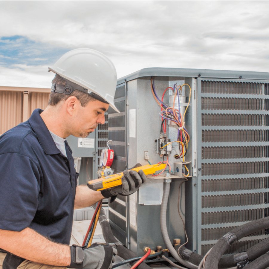 Woodstock HVAC Pros HVAC technician servicing a system