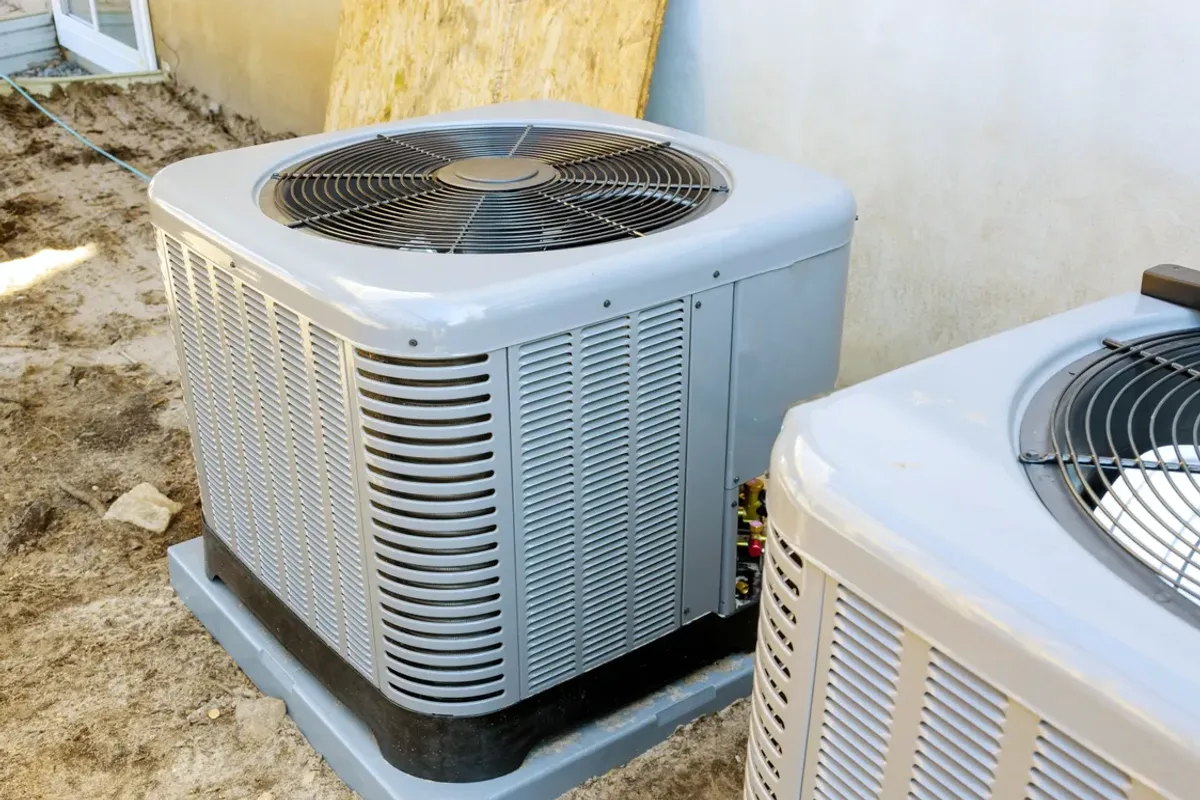 Two outdoor air conditioner condensers