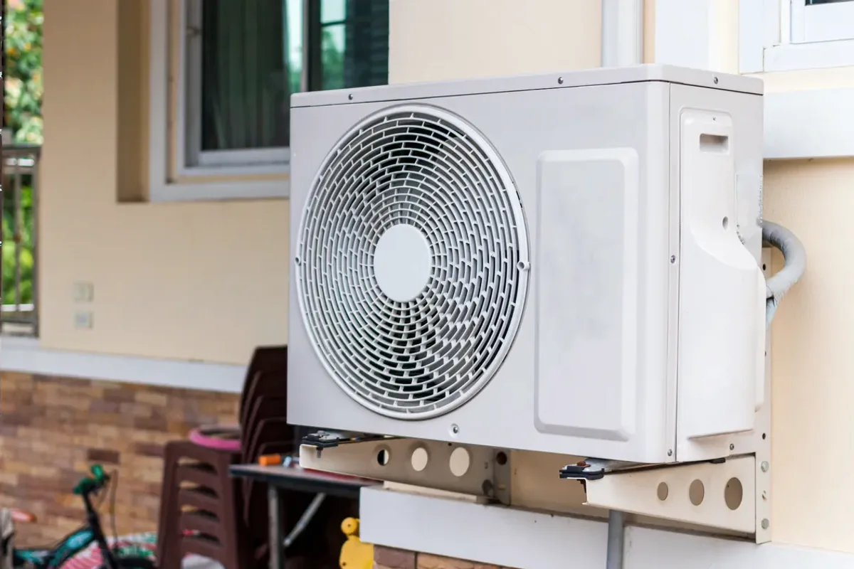 Outdoor heat pump unit on a wall bracket